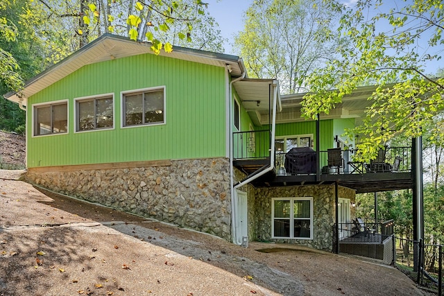 view of side of home with a balcony