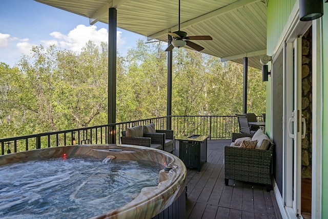 deck featuring an outdoor hangout area, ceiling fan, and a hot tub