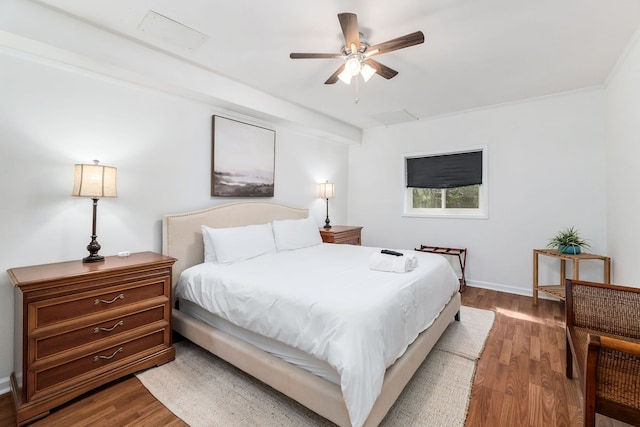 bedroom with crown molding, ceiling fan, and light hardwood / wood-style flooring