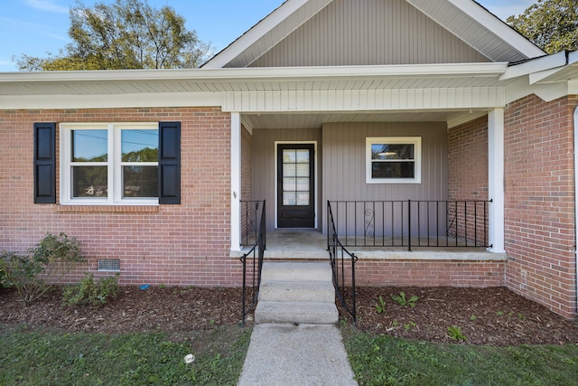 entrance to property featuring covered porch