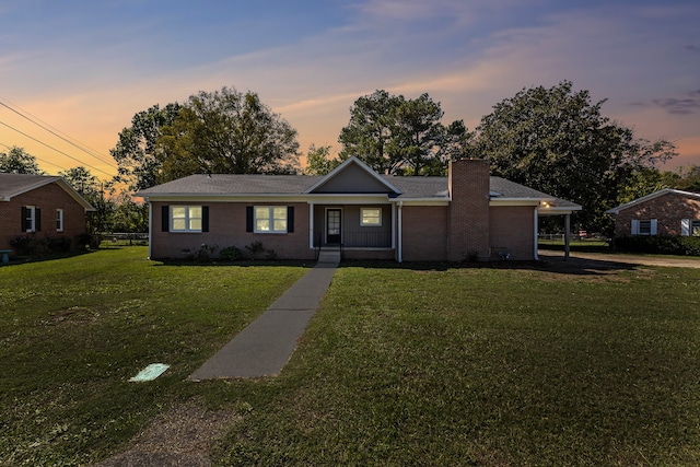 ranch-style house with a yard