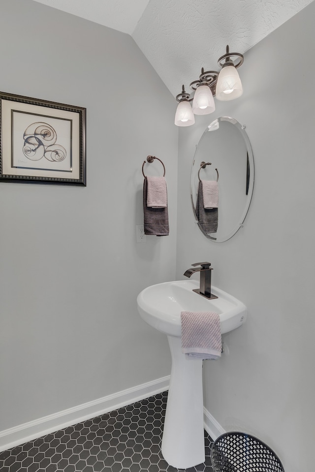 bathroom with vaulted ceiling