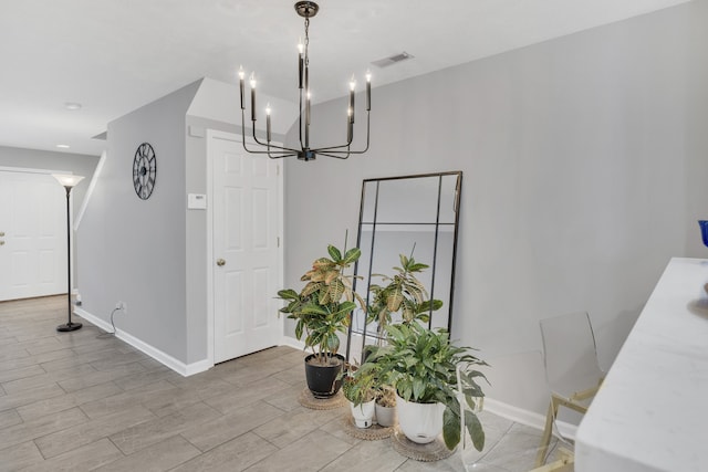 dining room featuring an inviting chandelier and light wood-type flooring