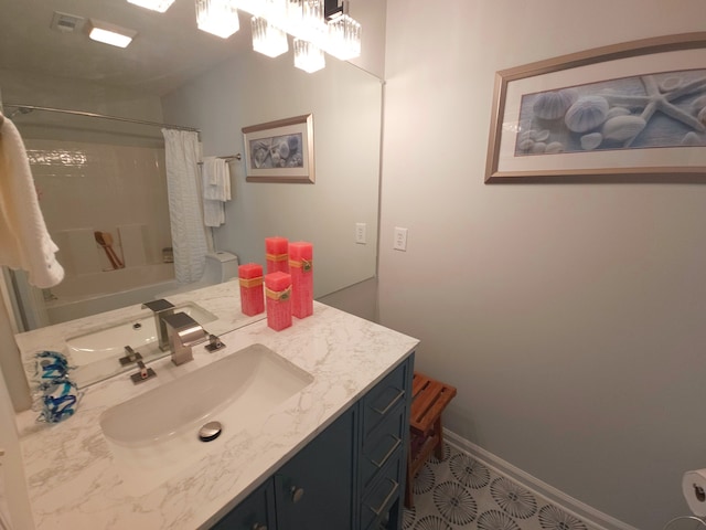 bathroom featuring vanity and shower / tub combo with curtain