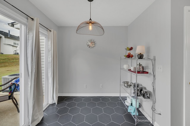 tiled dining area featuring plenty of natural light