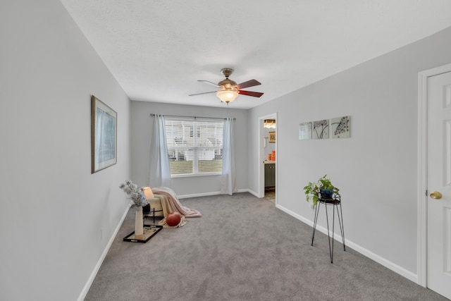 miscellaneous room featuring light carpet and ceiling fan