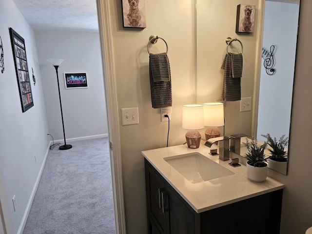 bathroom featuring vanity and a textured ceiling