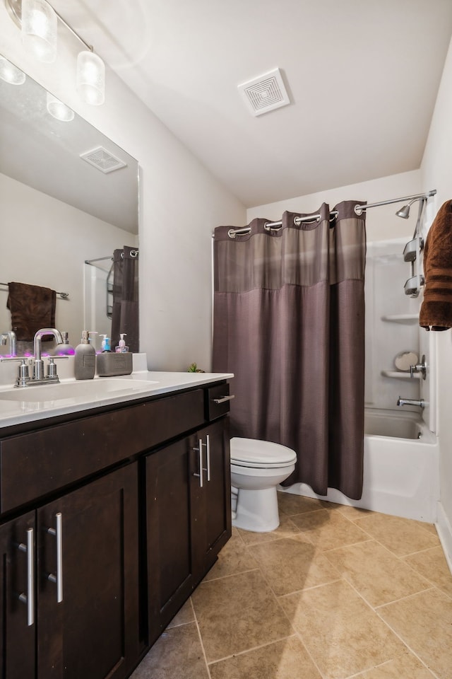 full bathroom featuring vanity, shower / tub combo with curtain, toilet, and tile patterned flooring