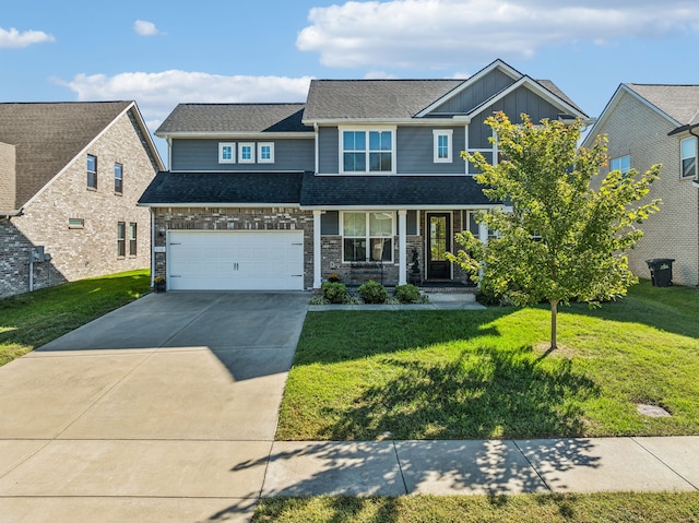 view of front of property featuring a porch, a front yard, and a garage