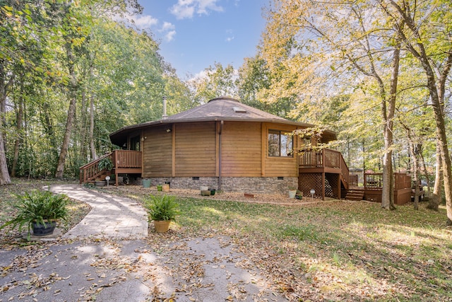 view of side of home with a wooden deck