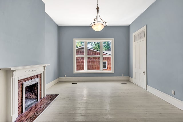 unfurnished living room with light hardwood / wood-style floors