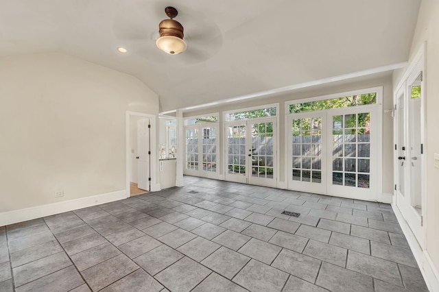 interior space with tile patterned flooring, french doors, vaulted ceiling, and ceiling fan