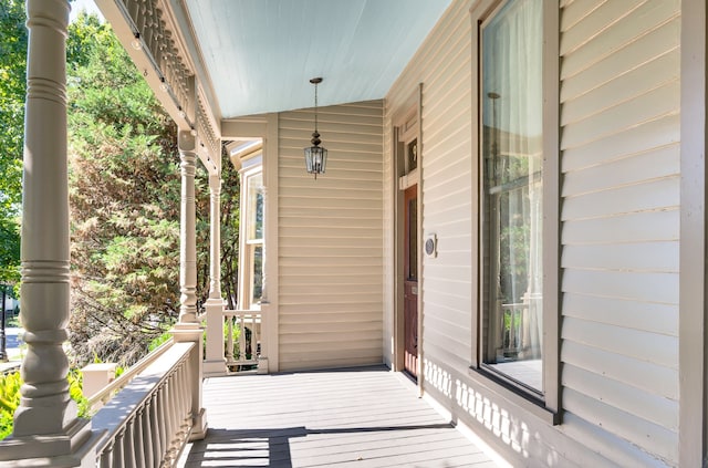 wooden terrace with a porch