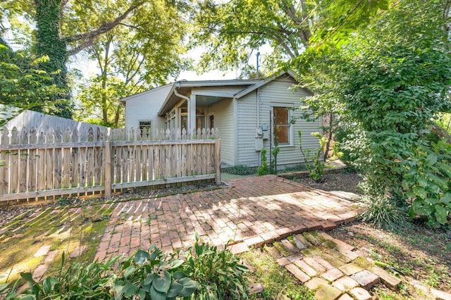 back of property featuring a patio