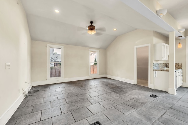 interior space with vaulted ceiling and ceiling fan