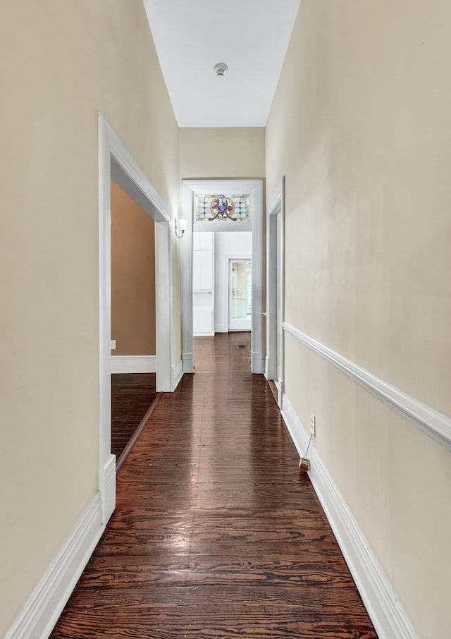 hall with dark hardwood / wood-style floors