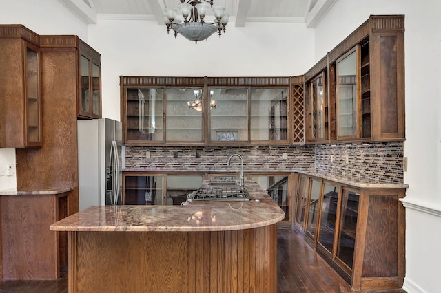 kitchen featuring beamed ceiling, light stone countertops, dark hardwood / wood-style floors, and stainless steel fridge with ice dispenser