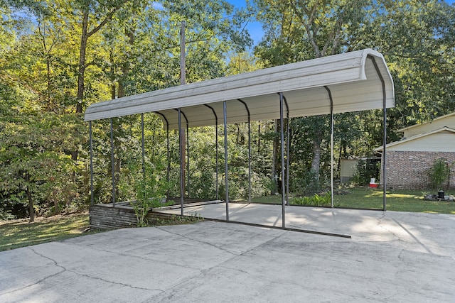 view of parking with a yard and a carport