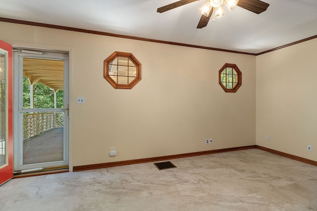 empty room featuring crown molding and ceiling fan