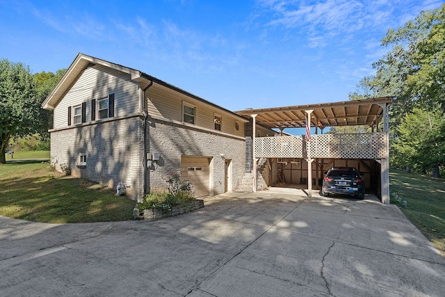 view of side of home with a garage, a lawn, and a carport