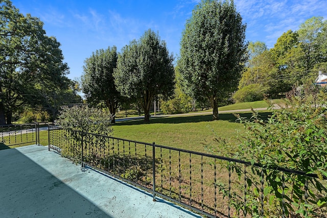 view of home's community featuring a lawn