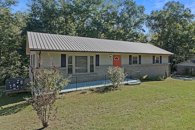 ranch-style home with a front lawn