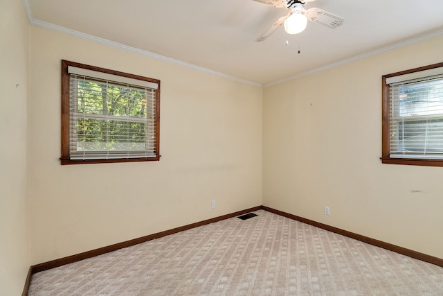 carpeted empty room with ornamental molding and ceiling fan