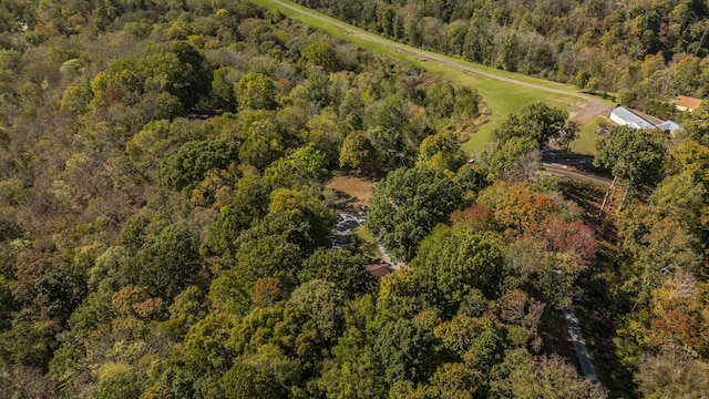 aerial view featuring a wooded view
