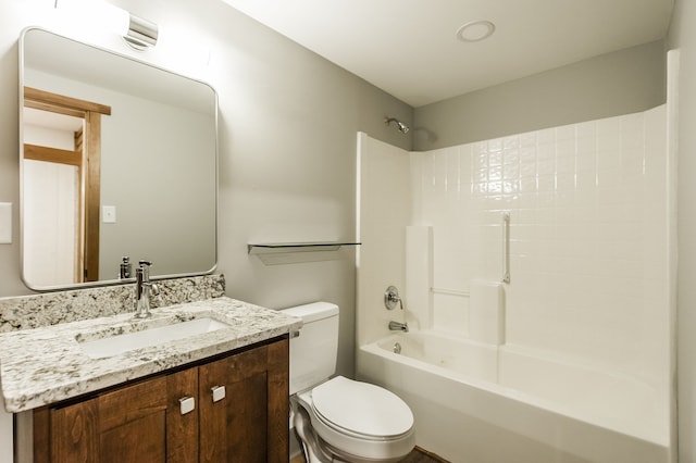 full bathroom with  shower combination, vanity, and toilet