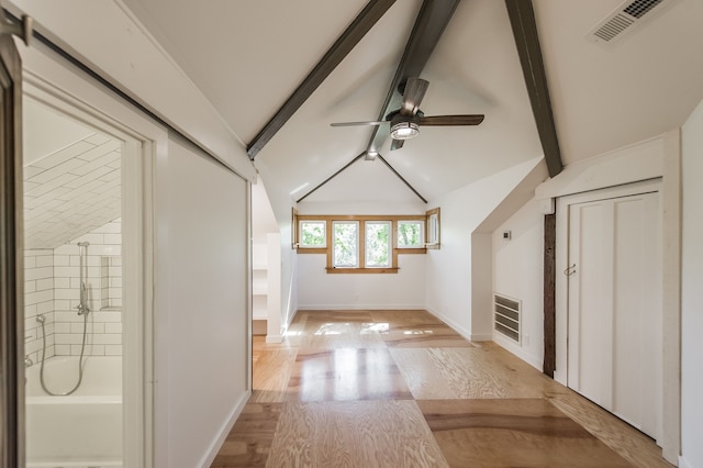 bonus room featuring ceiling fan, vaulted ceiling with beams, and light wood-type flooring