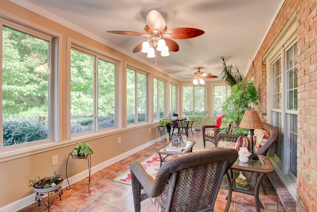 sunroom / solarium featuring ceiling fan