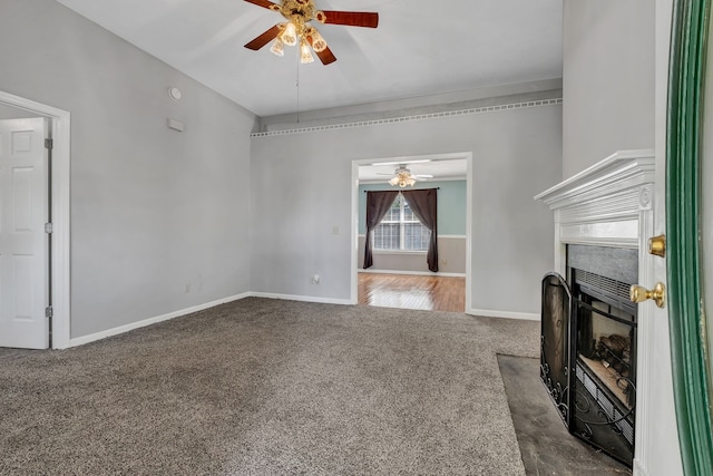 unfurnished living room with carpet and ceiling fan