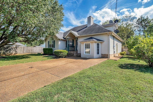 view of front facade with a front lawn and a patio area