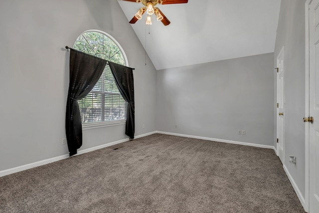 carpeted empty room featuring high vaulted ceiling and ceiling fan