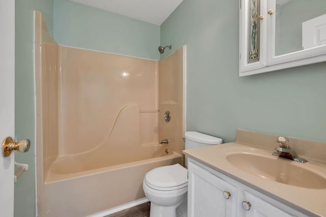 full bathroom with washtub / shower combination, wood-type flooring, vanity, and toilet