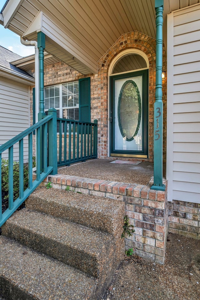 property entrance with covered porch