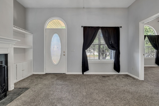 view of carpeted entrance foyer