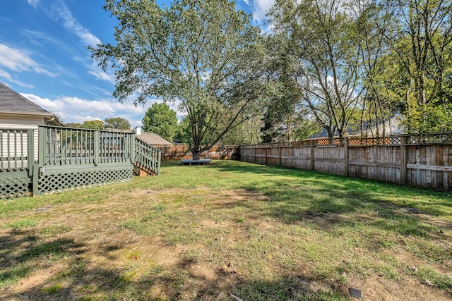 view of yard with a wooden deck