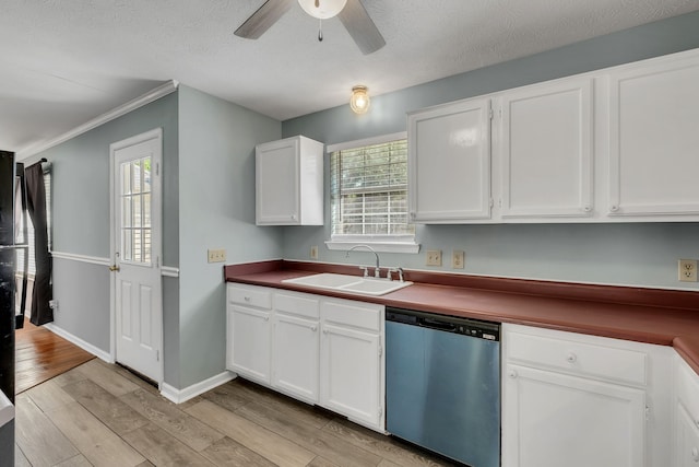 kitchen featuring light wood-type flooring, a healthy amount of sunlight, sink, and dishwasher