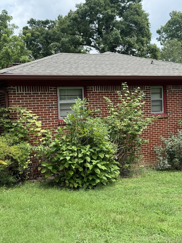 view of home's exterior featuring a yard