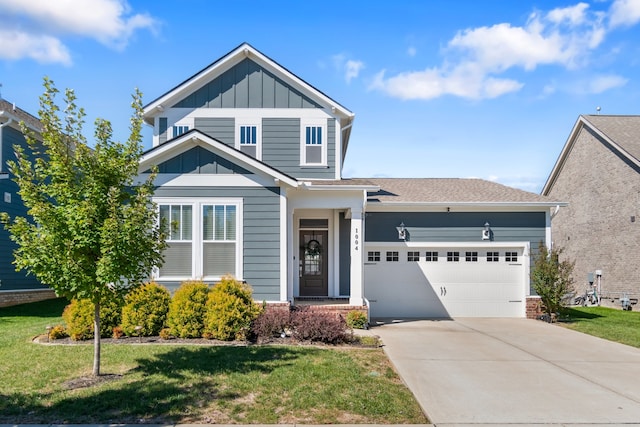 view of front of home with a garage and a front yard