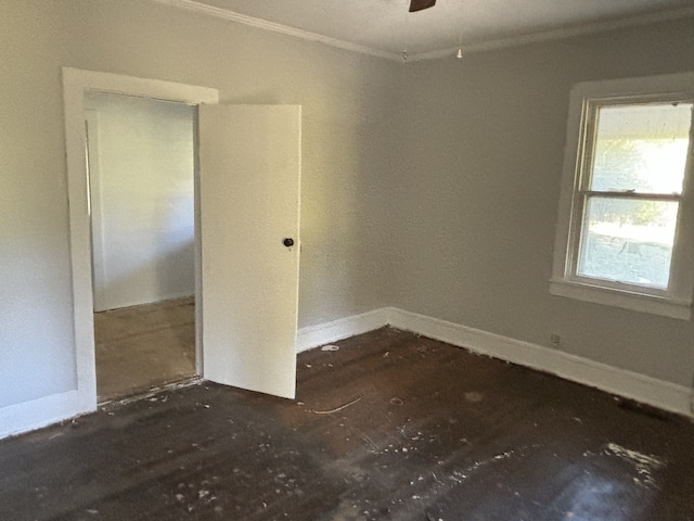 unfurnished room with ornamental molding and ceiling fan