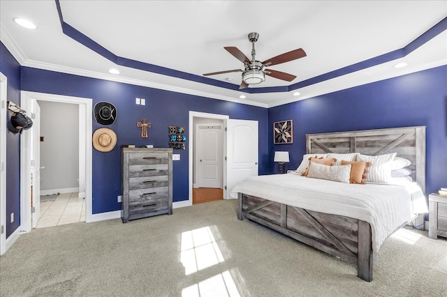 carpeted bedroom featuring crown molding and ceiling fan