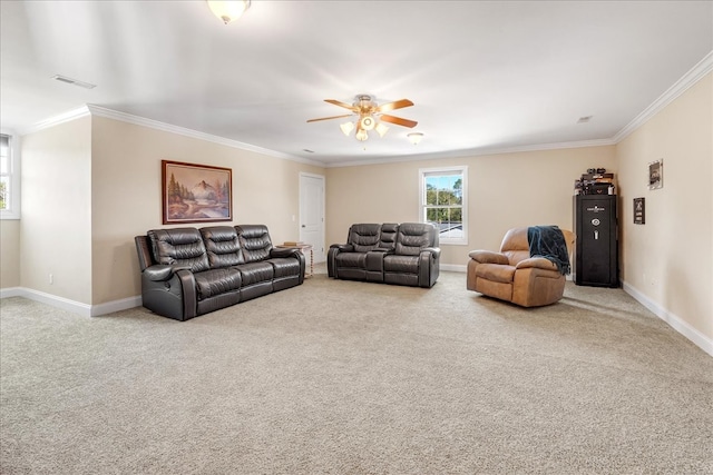 carpeted living room with crown molding and ceiling fan