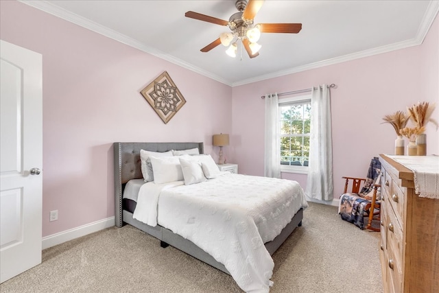 carpeted bedroom with crown molding and ceiling fan