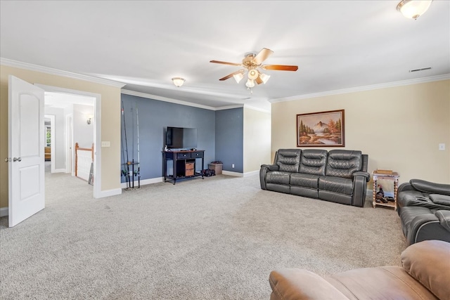 living room featuring ornamental molding, ceiling fan, and carpet floors