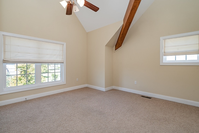 spare room featuring high vaulted ceiling, ceiling fan, beamed ceiling, and light colored carpet