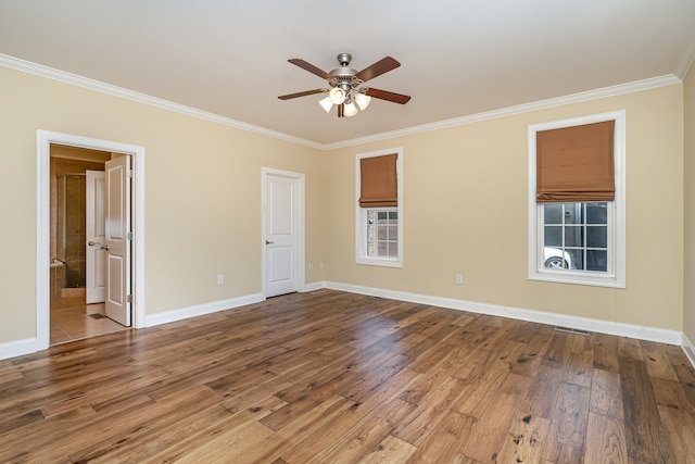 unfurnished room with wood-type flooring, ornamental molding, and ceiling fan