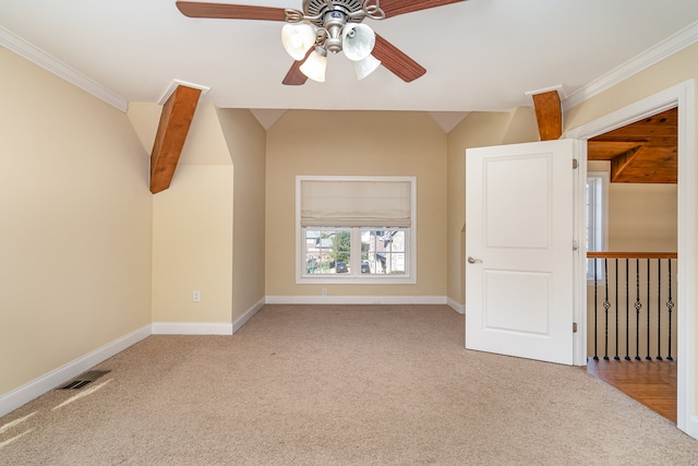 empty room with crown molding, light colored carpet, and ceiling fan