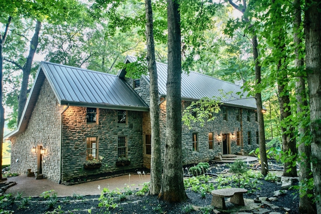 back of house with a patio